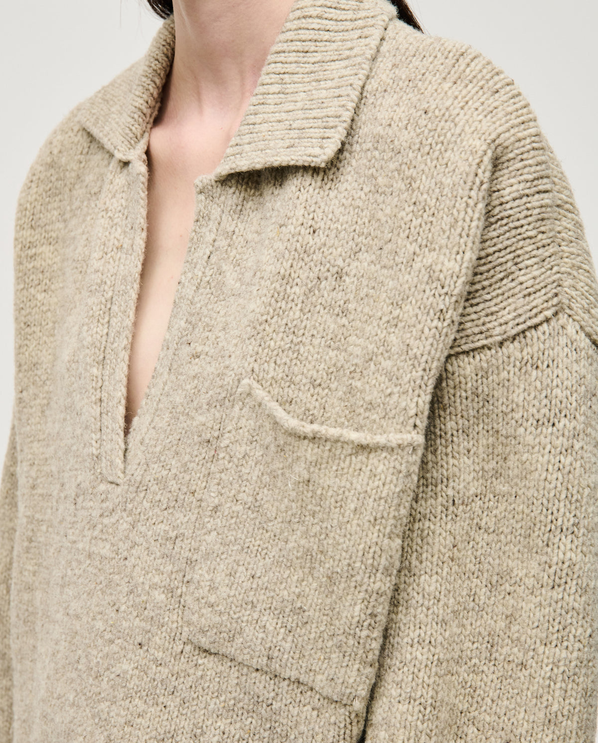 Woman wearing Babaà Polo No93 Mist in a close-up shot, showcasing the soft fabric and stylish design of the polo shirt.