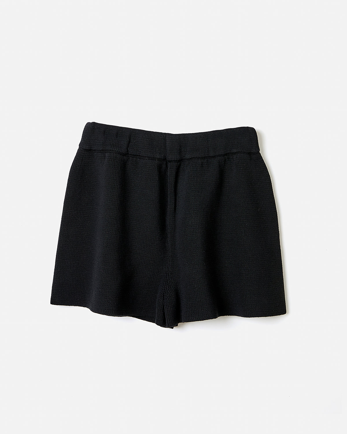 Black Babaà No35 shorts worn by a woman, showcasing the stylish silhouette and relaxed fit of the casual shorts.