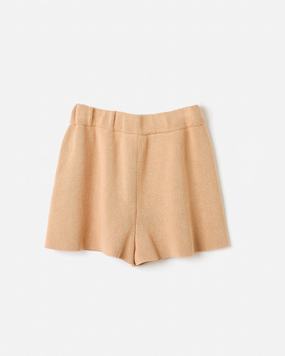 Silhouette of a woman wearing Babaà Shorts No35 in clay color, showcasing casual summer shorts on a white background.