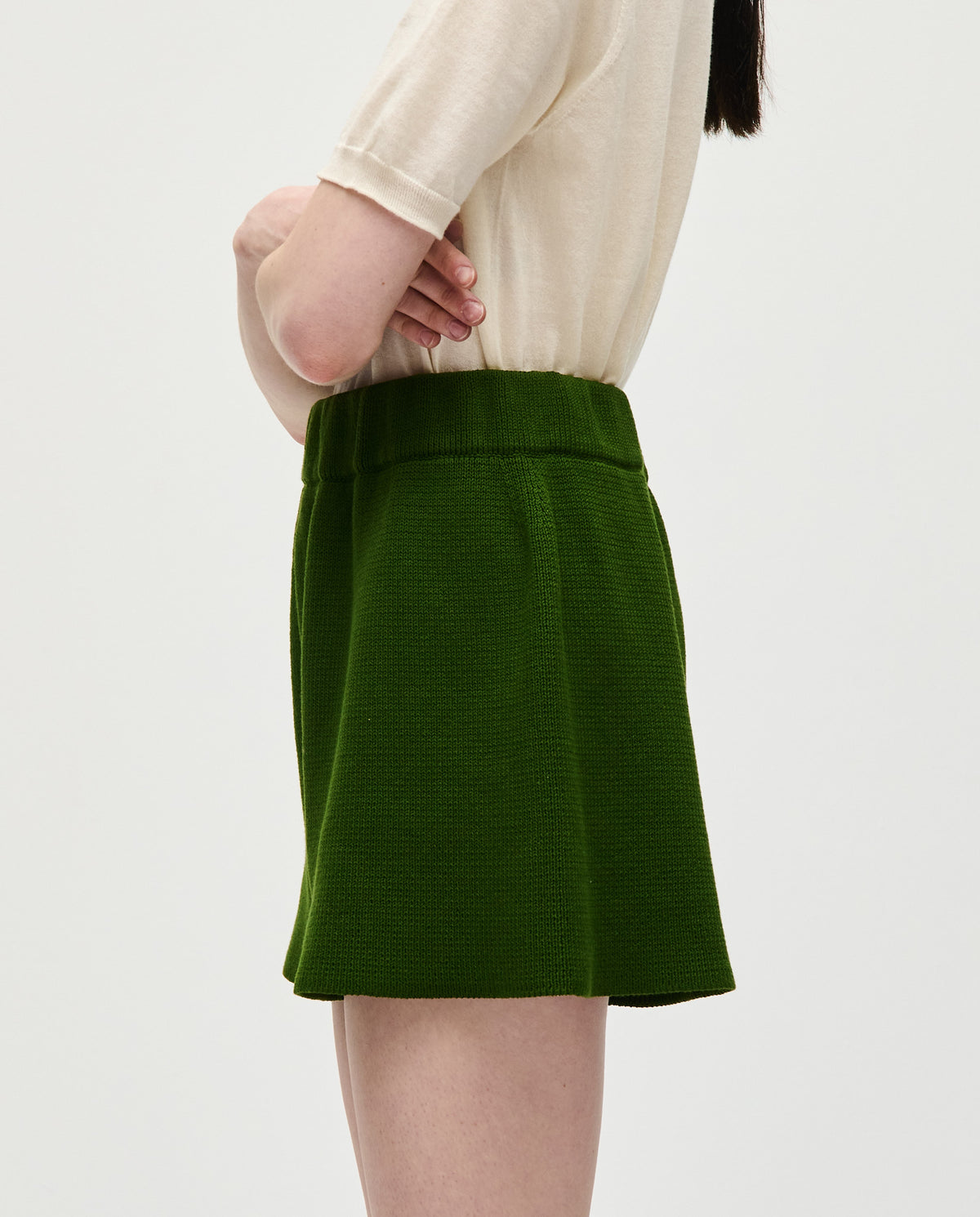 Woman wearing Babaà No35 Pine shorts, stylish casual denim shorts with a relaxed fit and distressed detailing.