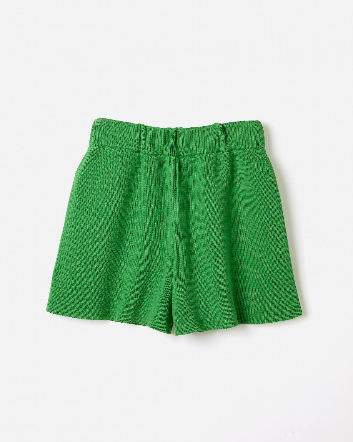 Woman wearing Babaà No35 Wild Fern shorts, featuring a relaxed fit and natural fabric in a scenic outdoor setting.