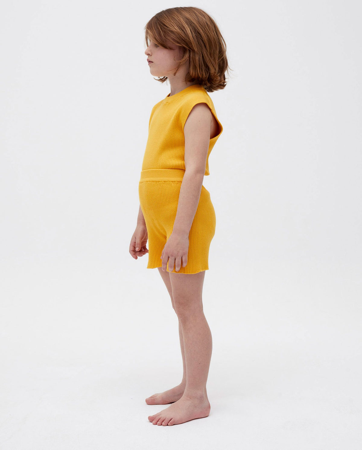 Kids' shorts by Babaà in Alphonso Mango color, featuring a comfortable fit and stylish design for children.