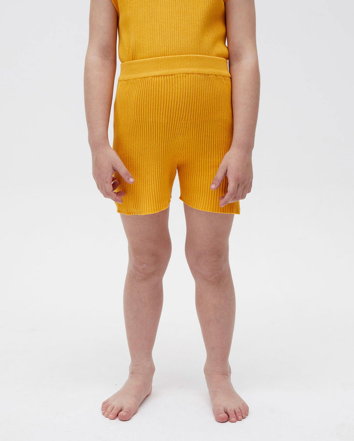 Kids' shorts by Babaà in Alphonso Mango color, featuring a comfortable fit and playful design for children.