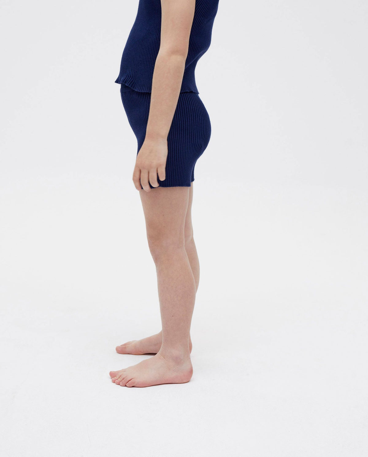 Navy kids' shorts No39 by Babaà, made of soft fabric with an elastic waistband, displayed on a hanger.