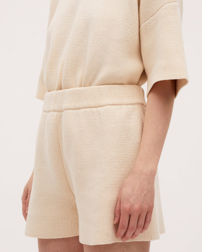 Babaà No35 natural shorts made of lightweight fabric, featuring a relaxed fit and neutral beige color for casual wear.