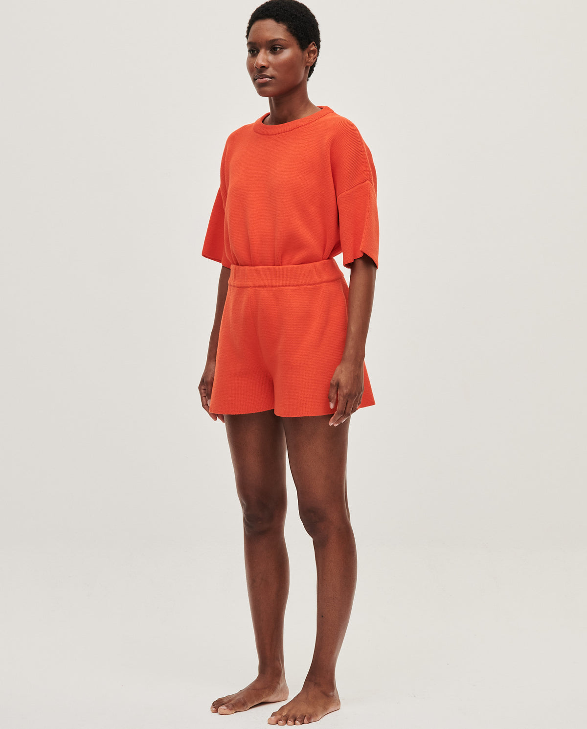 Babaà No35 Tangelo women's shorts in vibrant orange fabric, featuring a relaxed fit and casual style.