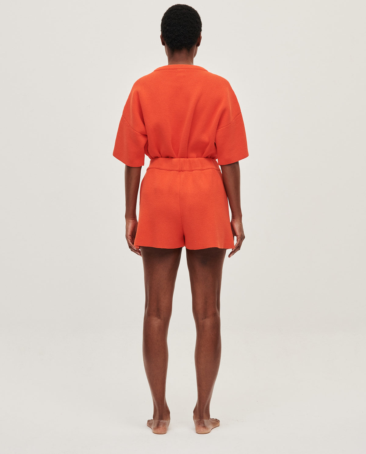 Babaà No35 Tangelo women's shorts in vibrant orange fabric, featuring a relaxed fit and stylish design.