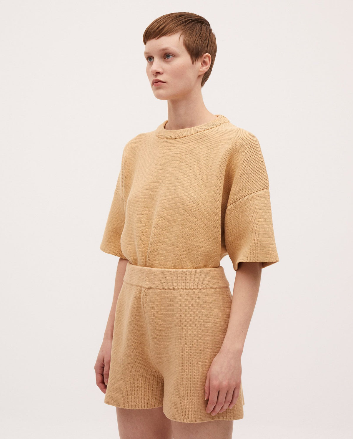 Babaà No35 Clay Pot shorts worn by a woman, featuring a casual fit and earthy clay pot pattern, suitable for summer wear.