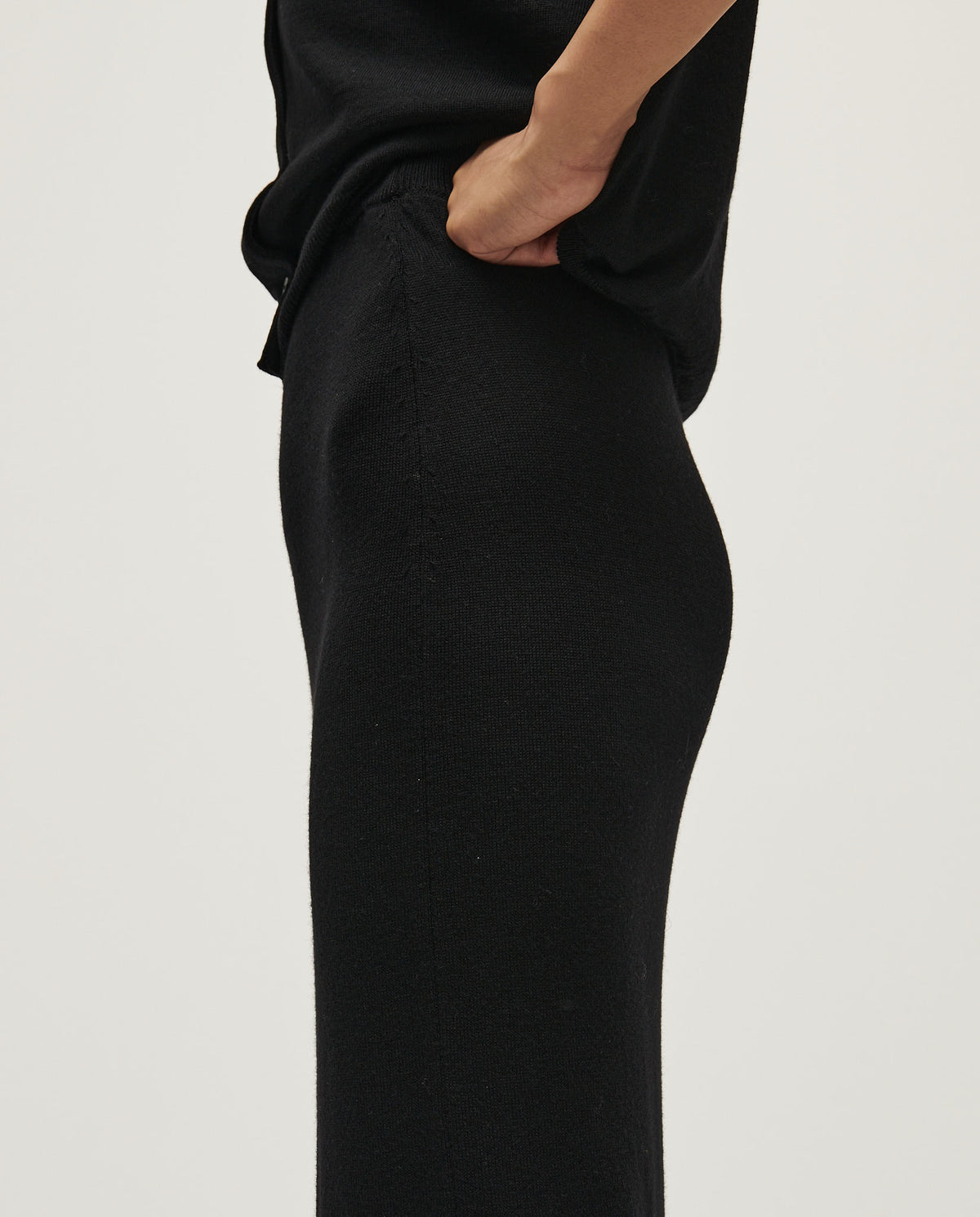 Black Babaà No25 women's skirt displayed on a hanger, showcasing its sleek design and fabric texture.