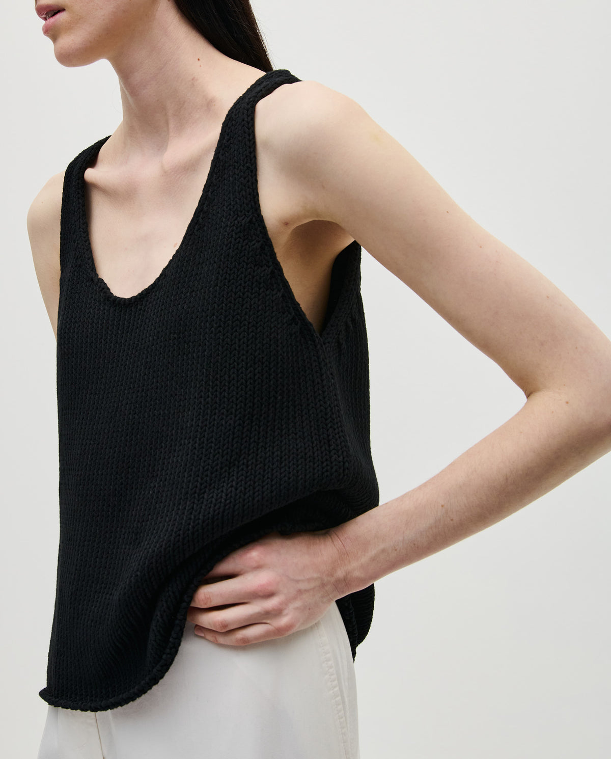 Black Top No1 by Babaà, stylish women's sleeveless top with a fitted design, shown on a model.