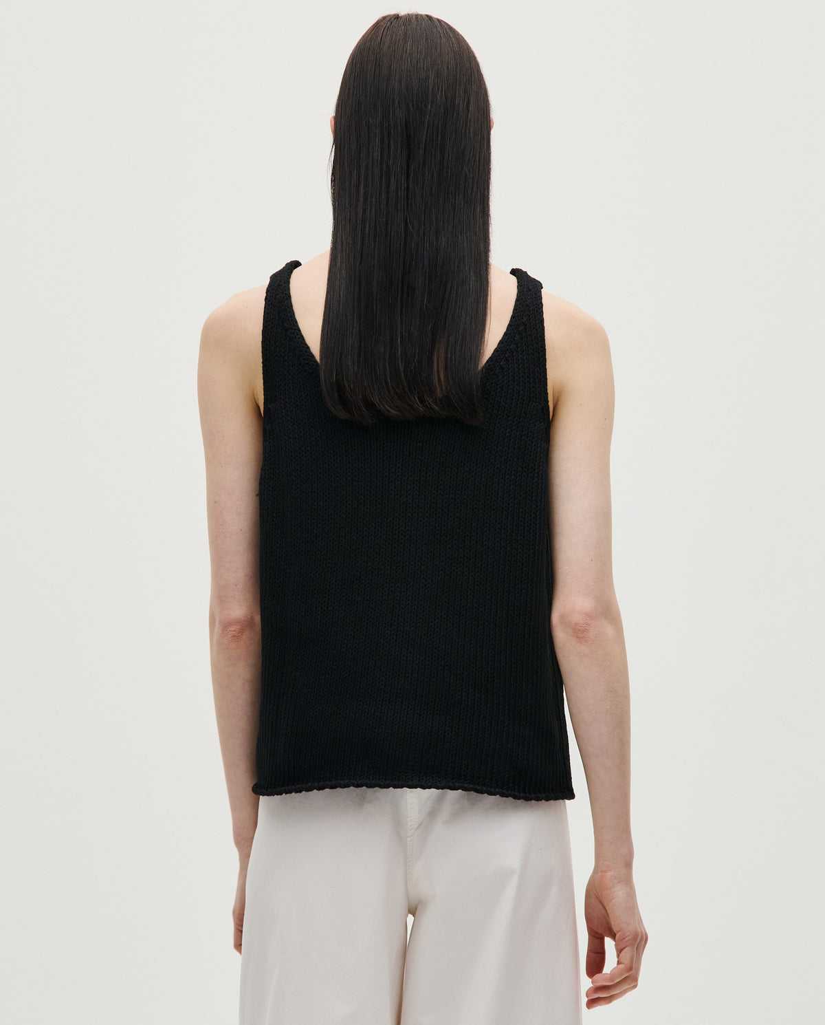Black top No1 by Babaà worn by a woman, featuring a stylish fit and modern design.