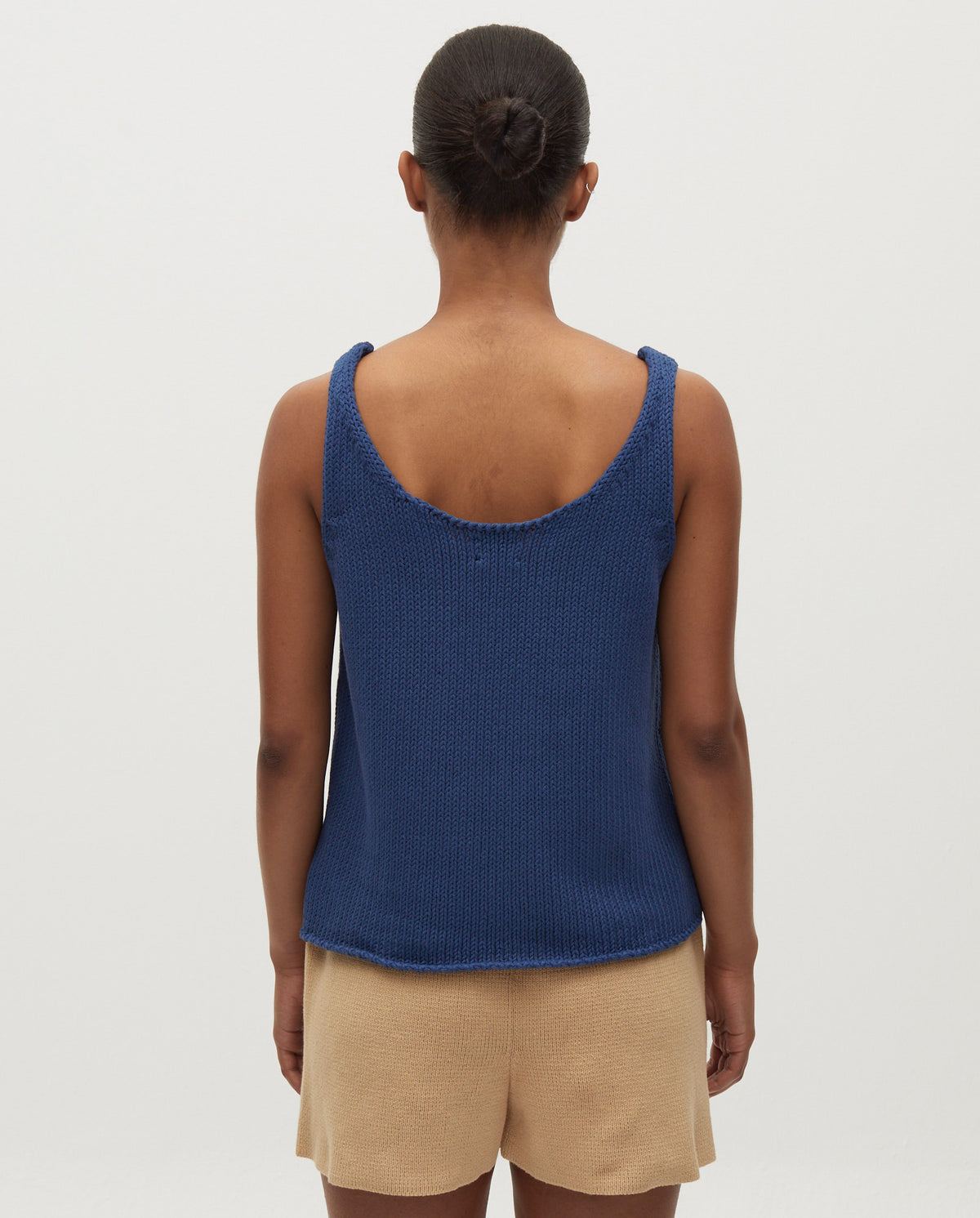 Babaà Top No1 Deep Water worn by a woman, close-up view of the stylish swimsuit top with deep water color.