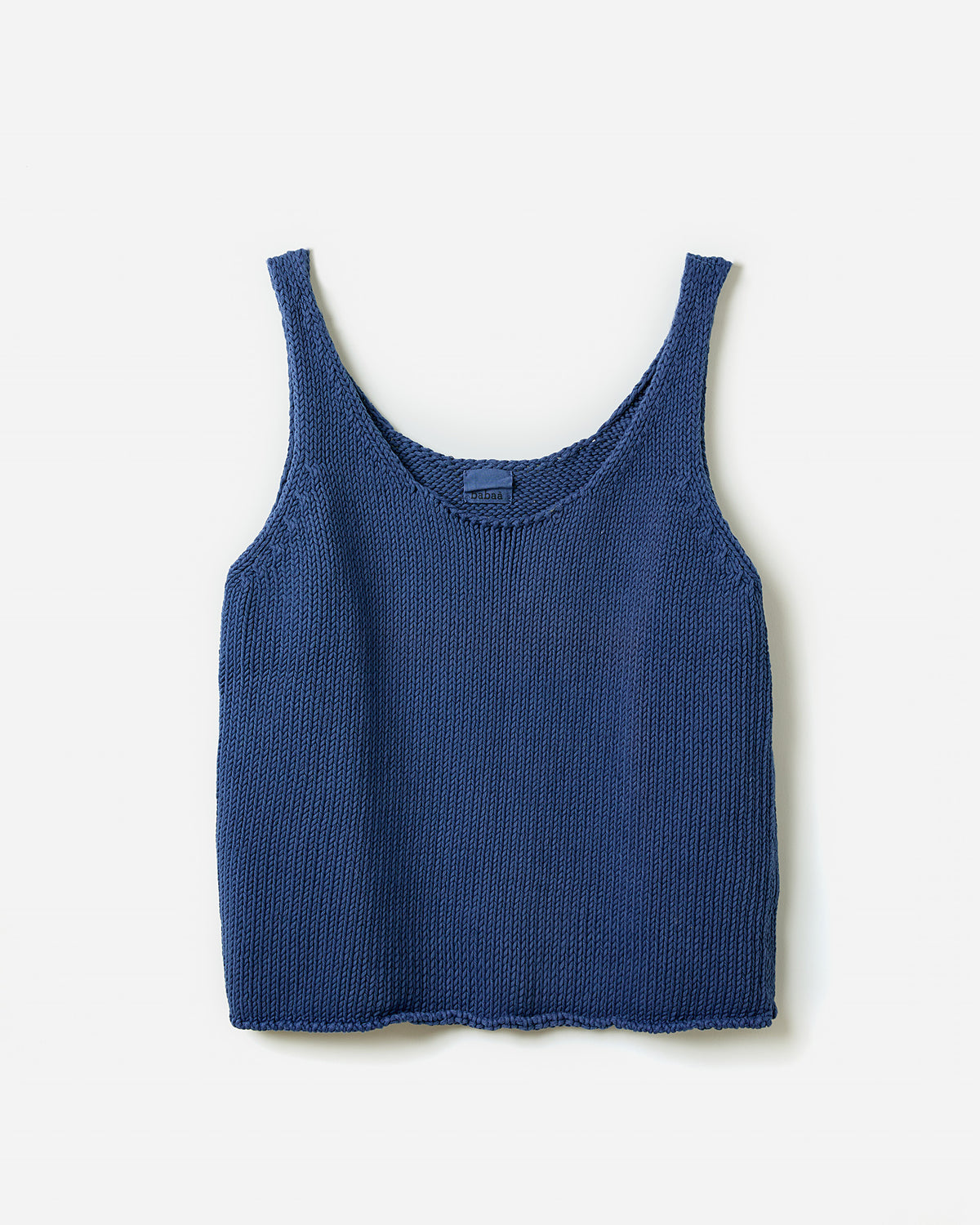 Silhouette of a woman wearing the Babaà Top No1 Deep Water, stylish deep water-themed women's top, on a plain background.