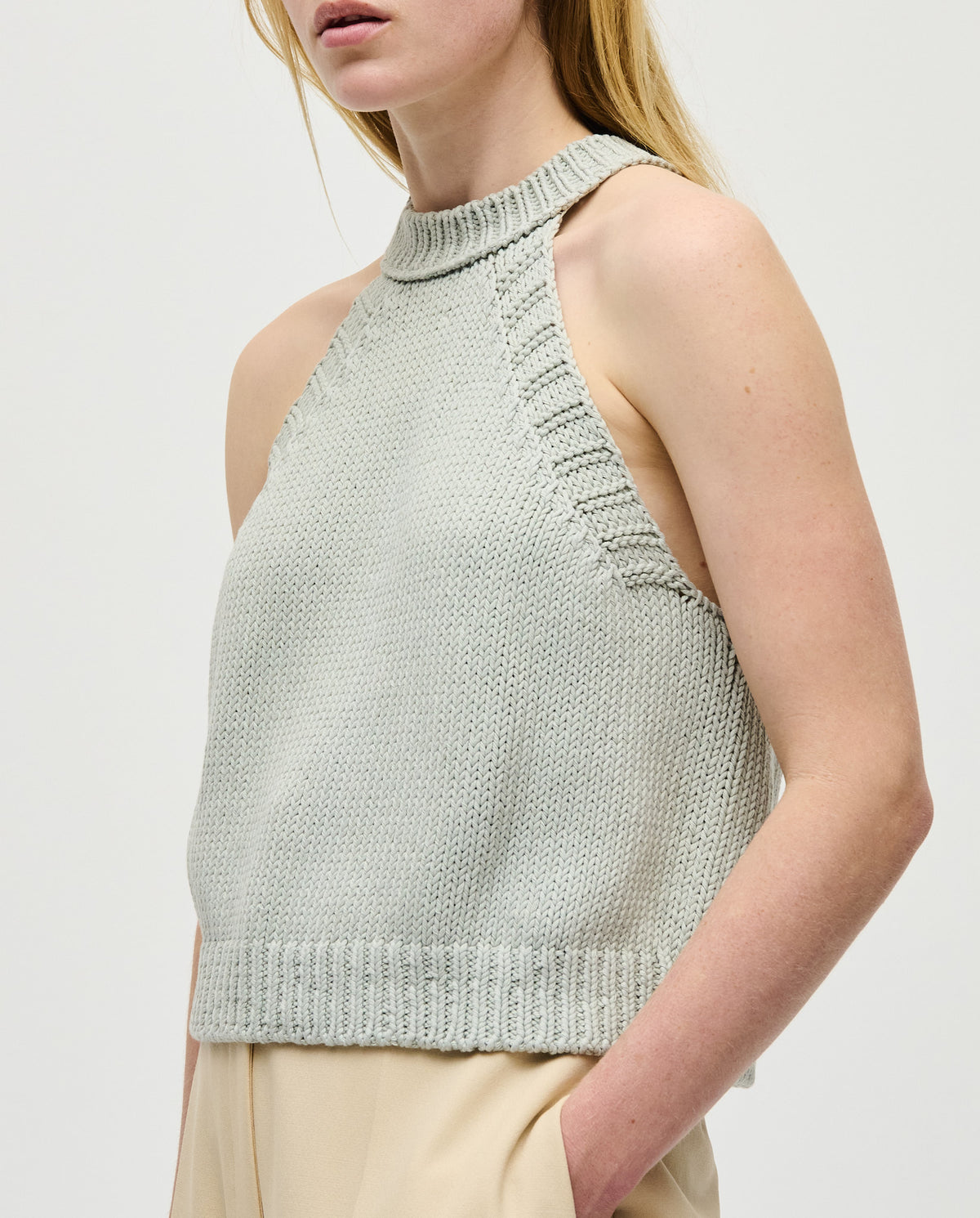 Woman wearing Babaà Top No2 Chalk in a casual outfit, showcasing the stylish design and fit of the top.