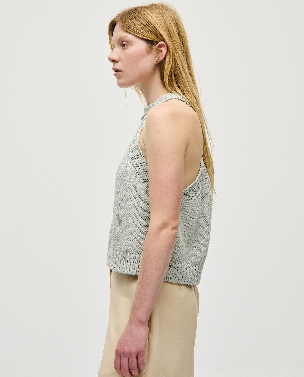 Woman wearing Babaà Top No2 Chalk, stylish sleeveless top with a relaxed fit and casual design.