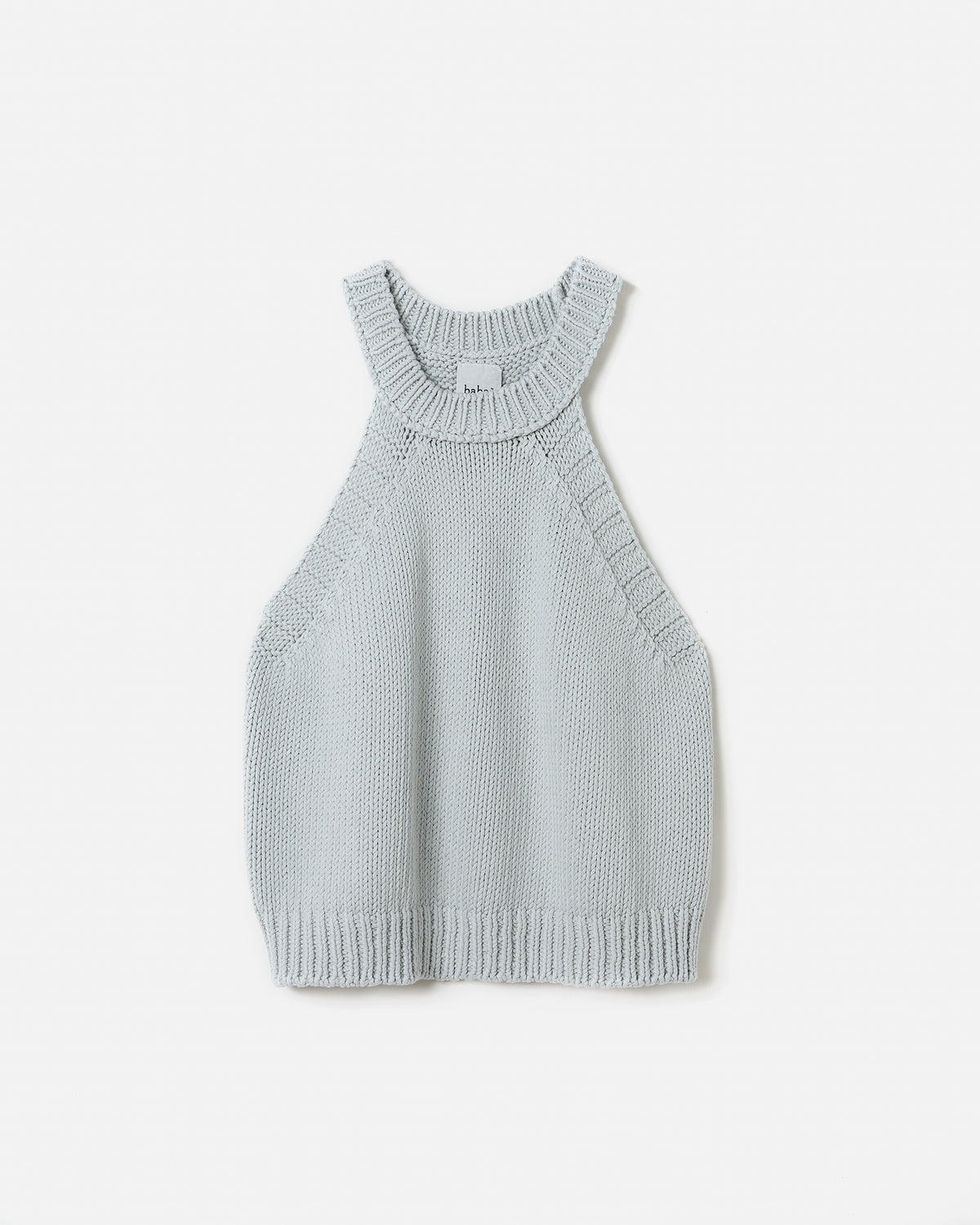 Silhouette of a woman wearing a Babaà Top No2 Chalk, showcasing its stylish design and fit.