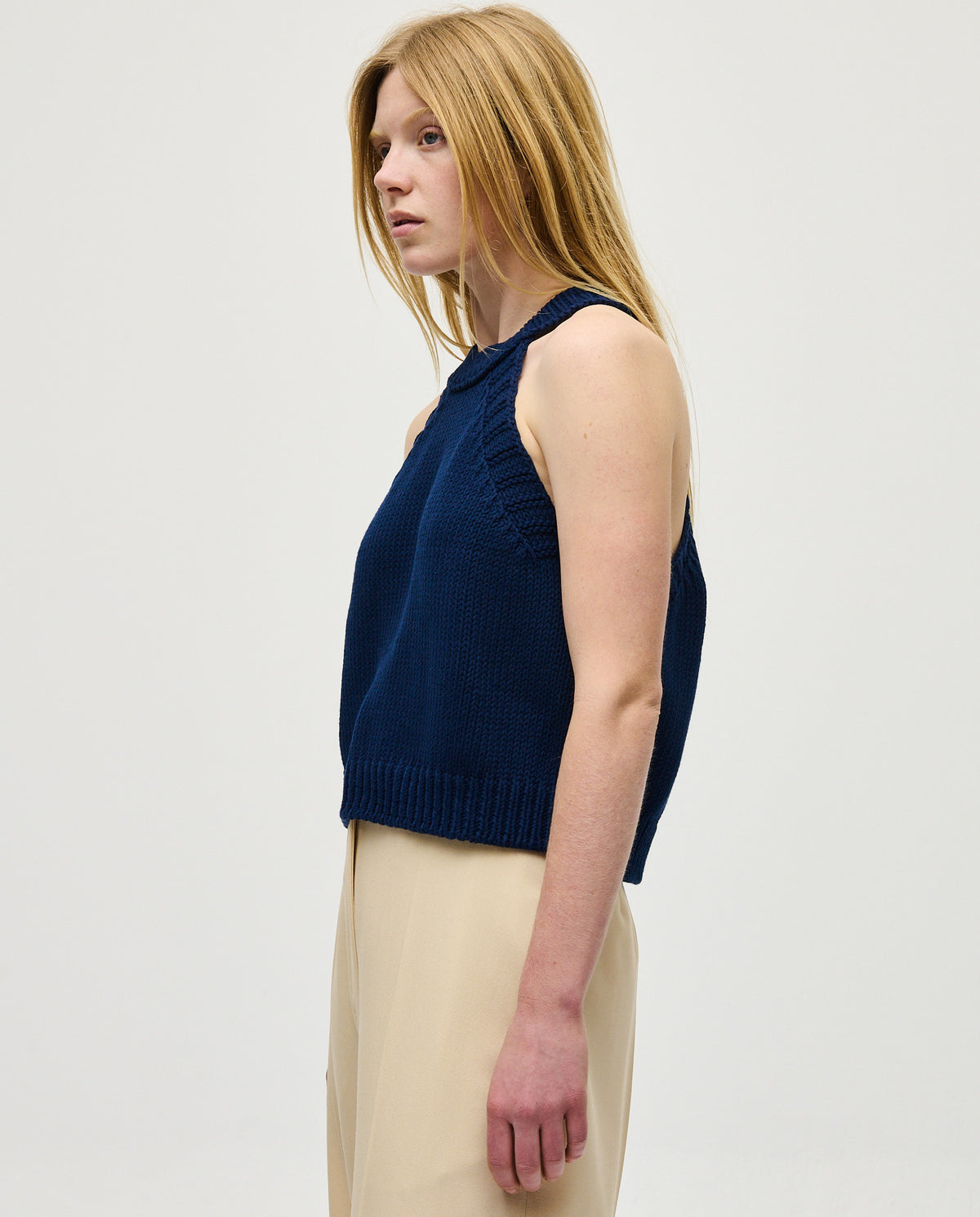 Navy Top No2 by Babaà worn by a woman, featuring a stylish, fitted design with short sleeves and a round neckline.