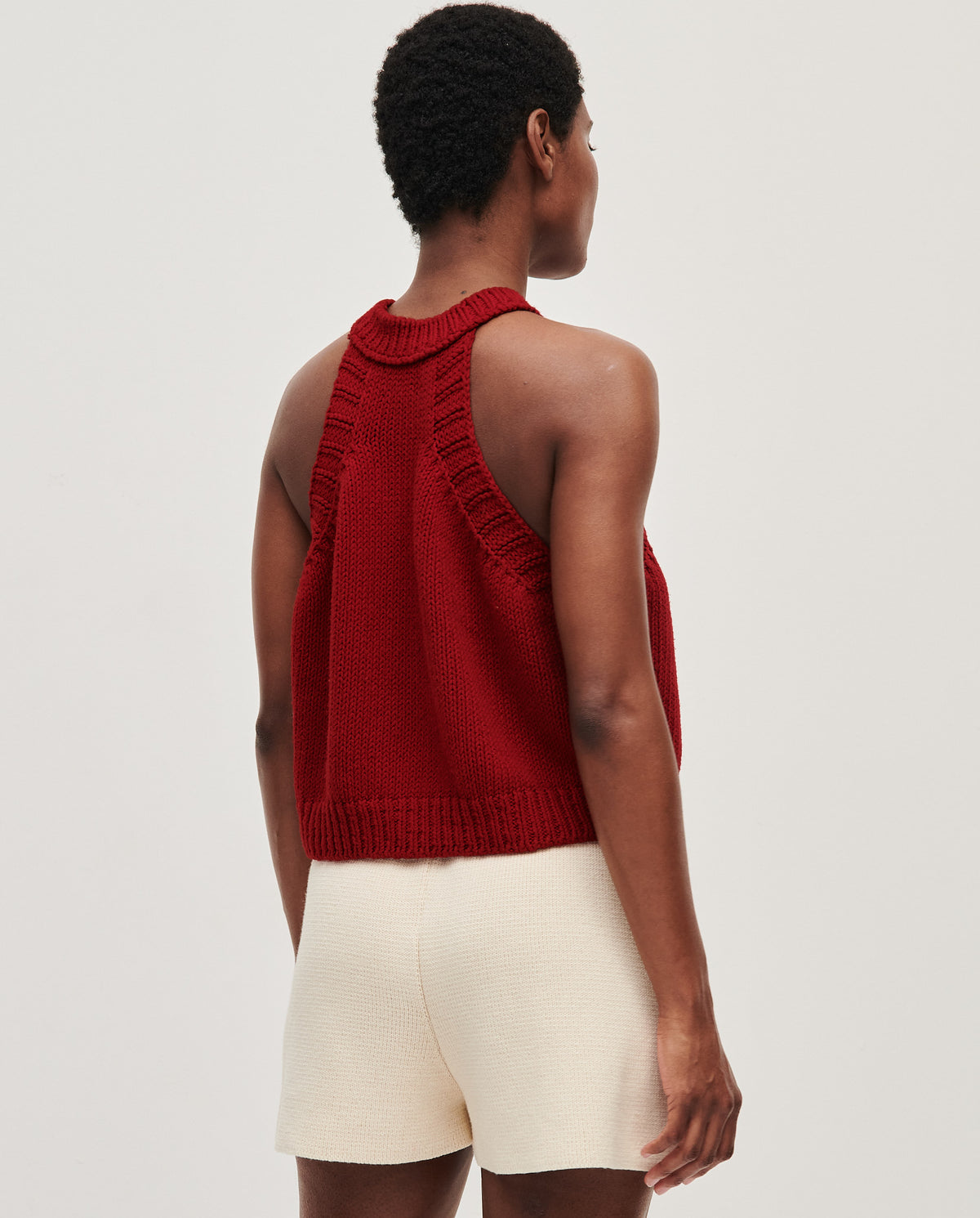 Babaà Top No2 Persephone, stylish women's sleeveless top with a fitted design, worn by a woman in a natural pose.