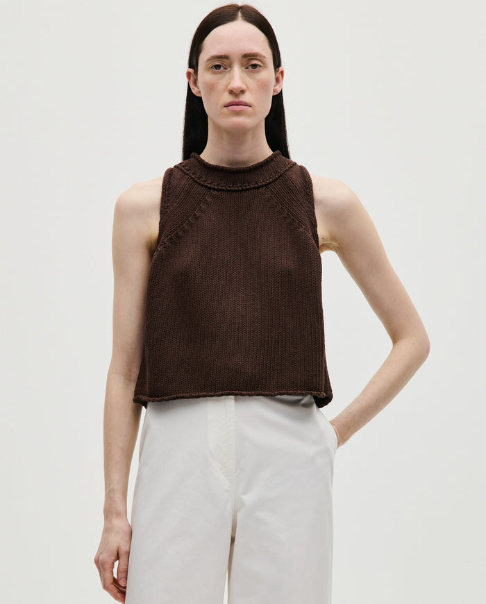 Woman wearing Babaà Top No46 Husk, stylish sleeveless top with textured fabric, casual and comfortable for everyday wear.