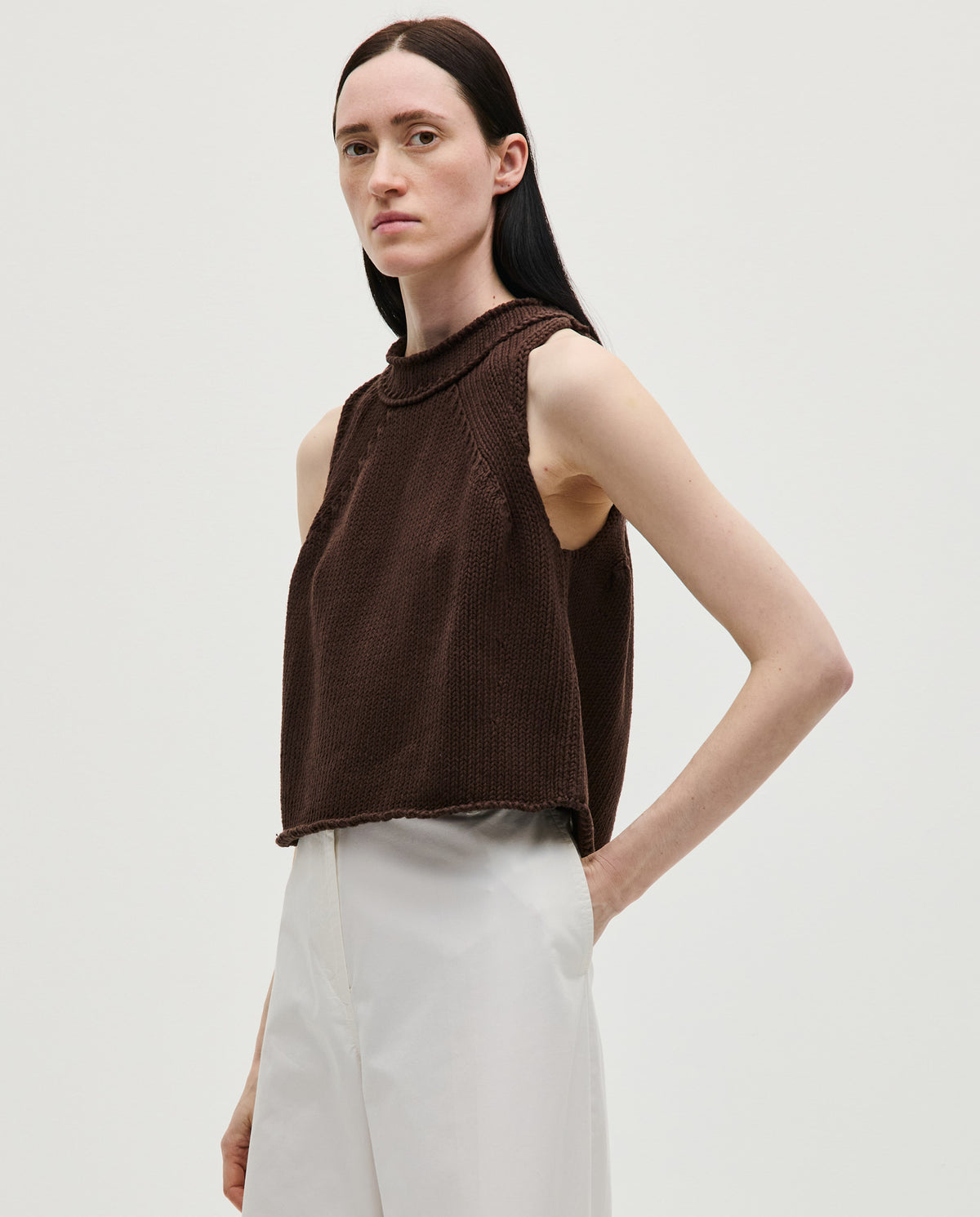 Woman wearing Babaà Top No46 Husk, a stylish sleeveless blouse with a textured fabric and relaxed fit.