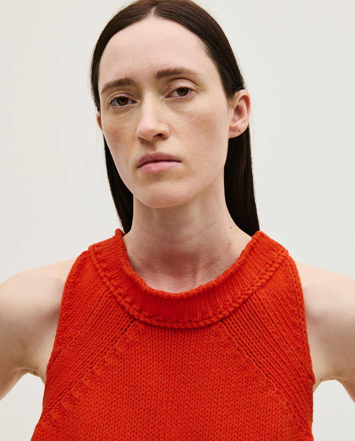 Babaà Top No46 Summer Flame worn by a woman, featuring a vibrant flame pattern and sleeveless design for warm weather.