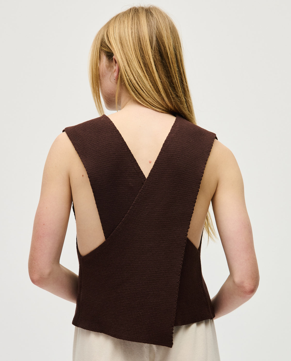 Babaà Top No85 Husk worn by a woman, featuring a stylish, textured fabric design for a fashionable look.