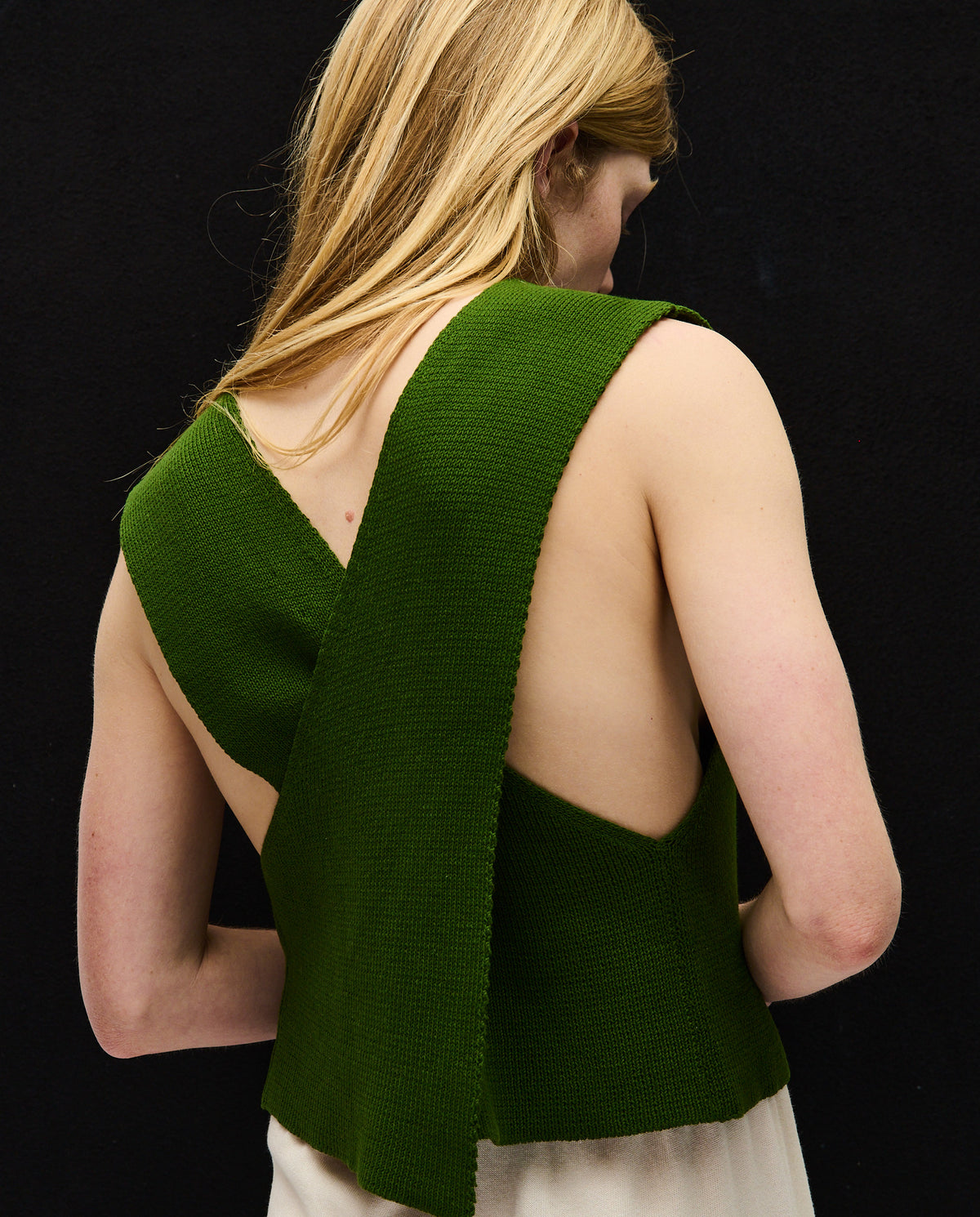 Woman wearing Babaà Top No85 Pine featuring a stylish, fitted design with soft fabric and elegant neckline.