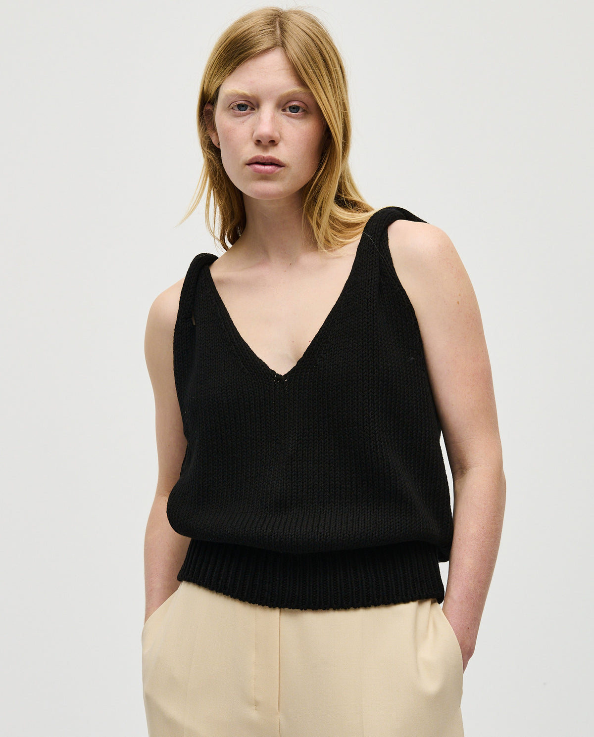 Black Babaà Top No88 worn by a woman, featuring a stylish design and comfortable fit, showcased on a model.
