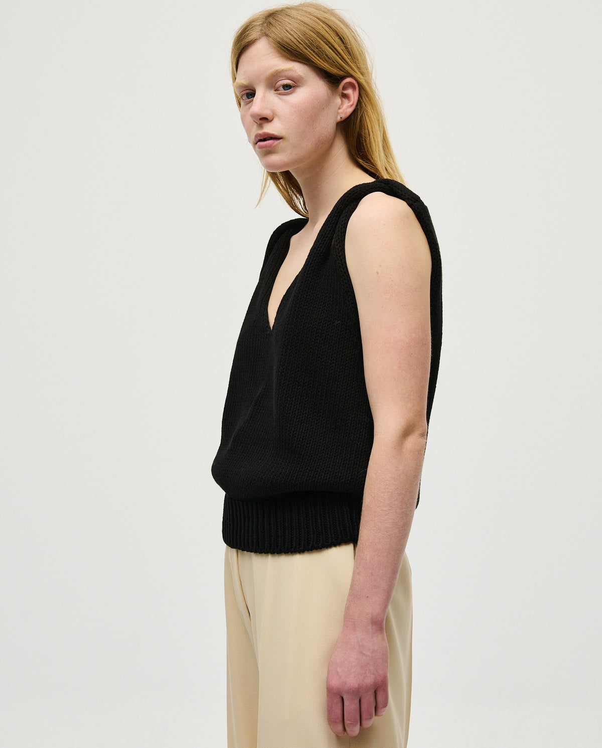Black babaà No88 women's top featuring a fitted design and stylish neckline, shown on a model with long hair.