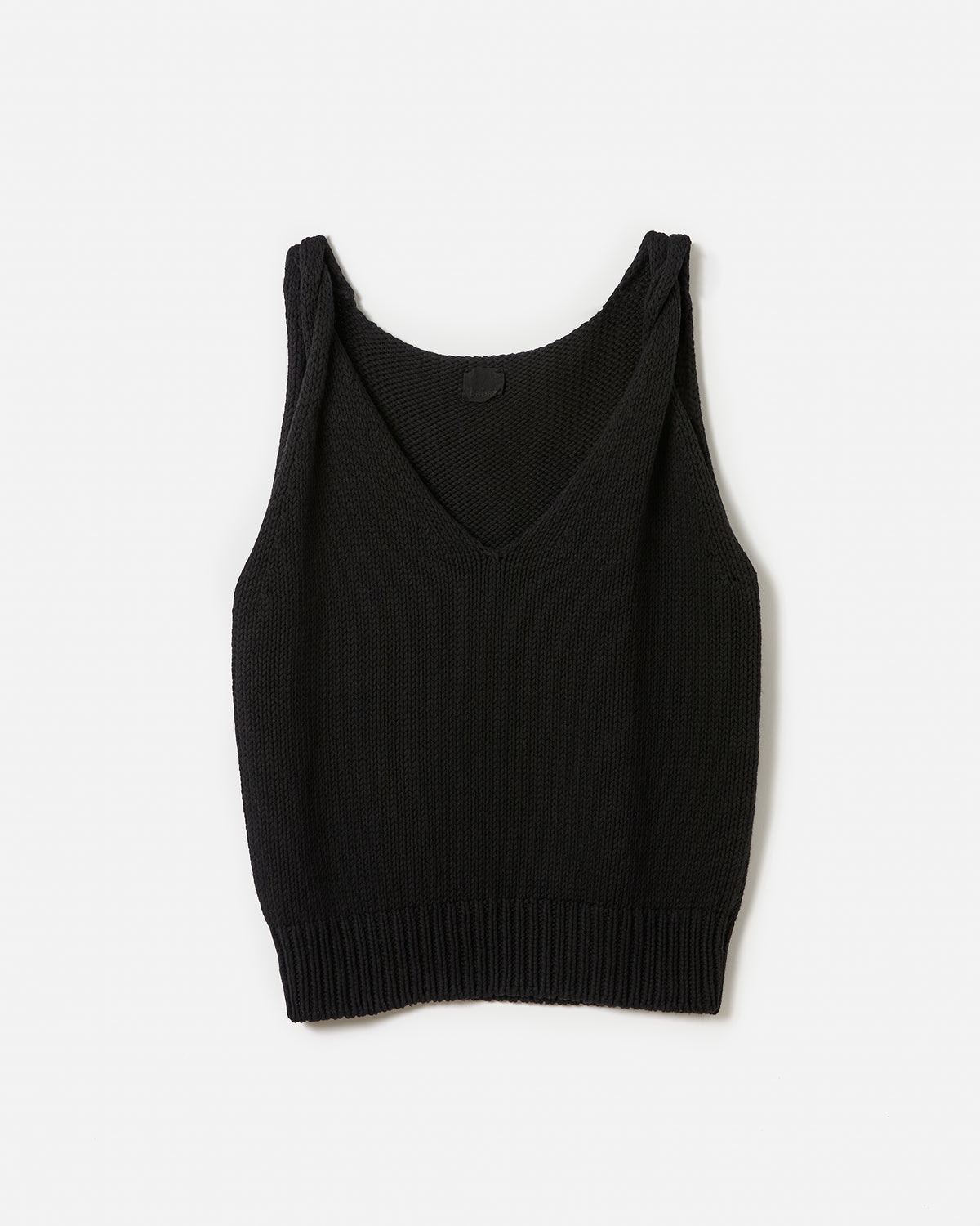 Black Babaà Top No88 worn by a woman, featuring a sleek silhouette and stylish design, perfect for casual or dressy occasions.