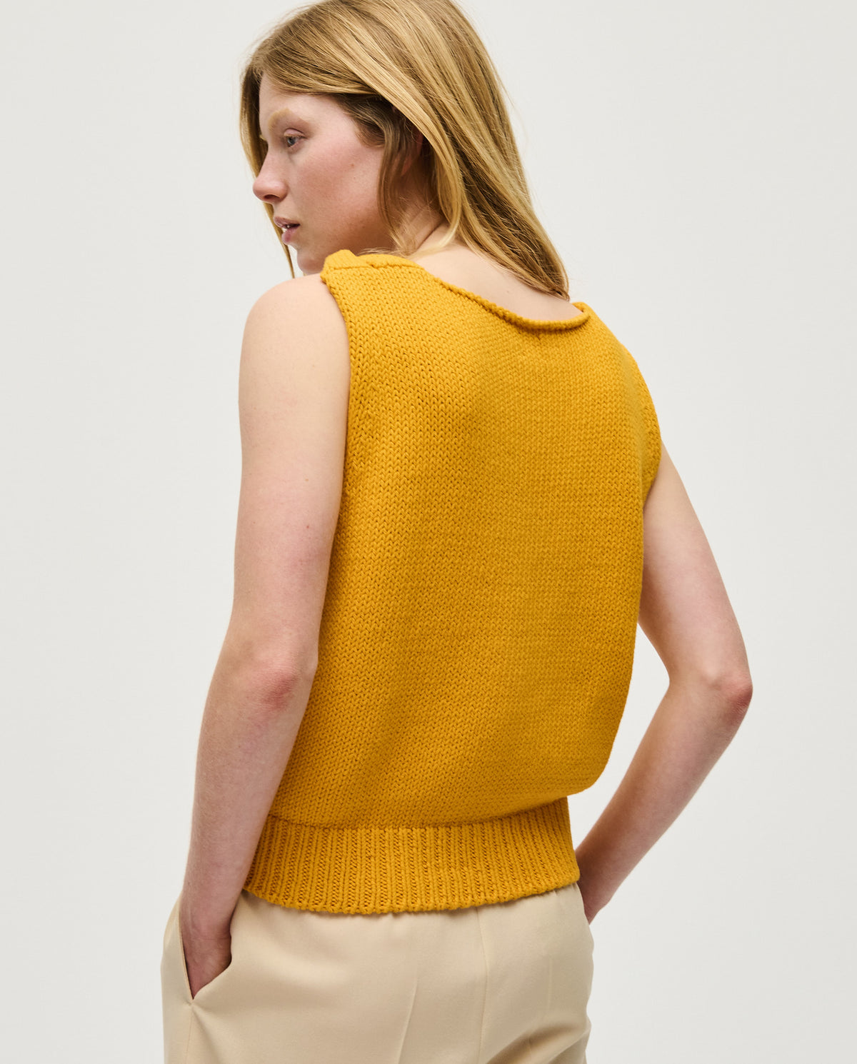 Babaà No88 Yolk women's top in vibrant yellow, stylish sleeveless design with a round neckline and relaxed fit.