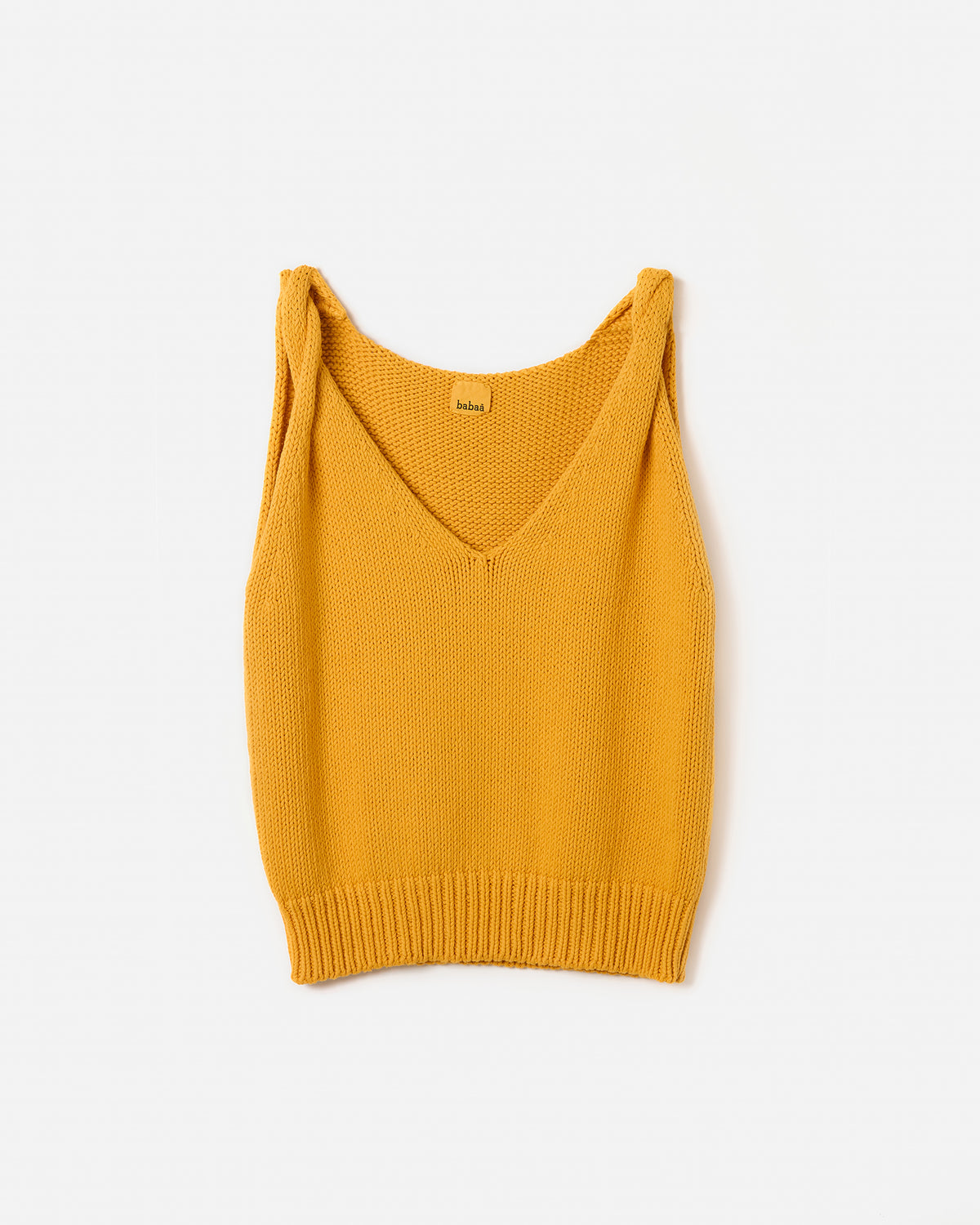 Silhouette of a woman wearing the Babaà No88 Yolk top, showcasing its stylish design and fit.