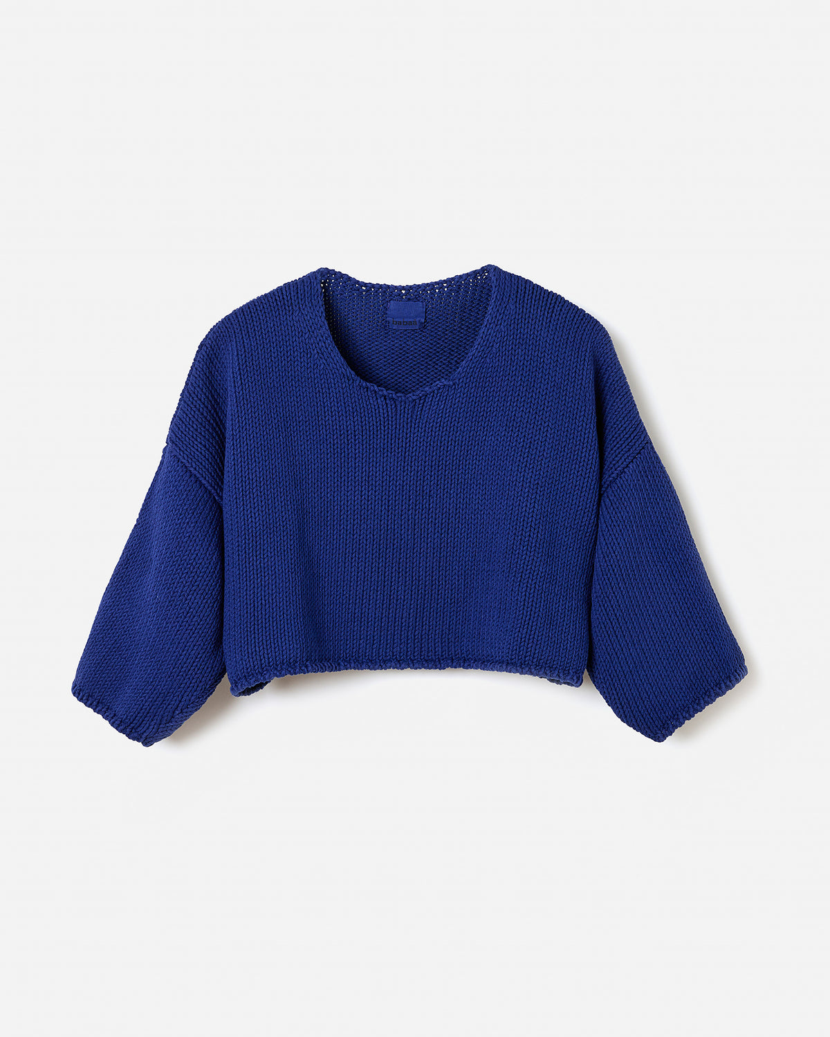 Silhouette of a woman wearing the Babaà Top No9 Puddle, showcasing its stylish design and fit.