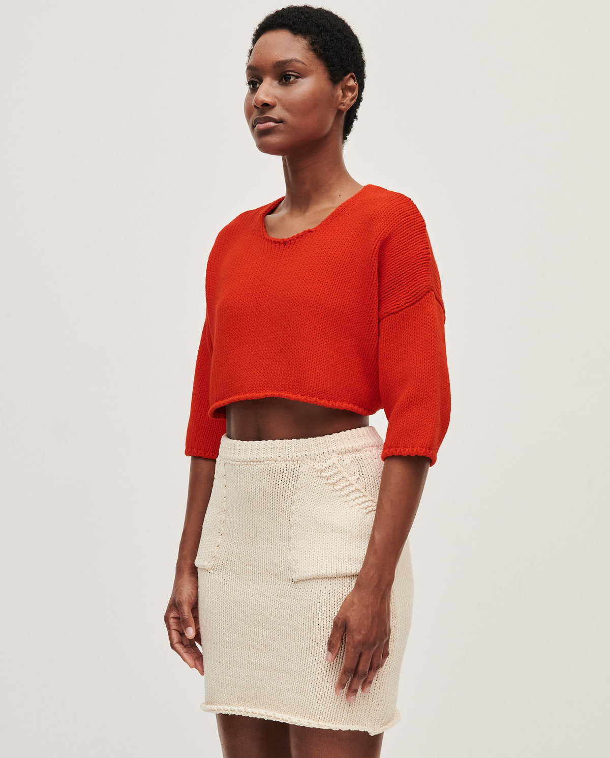 Babaà No9 Summer Flame top worn by a woman, featuring a vibrant, lightweight fabric with a stylish summer design.