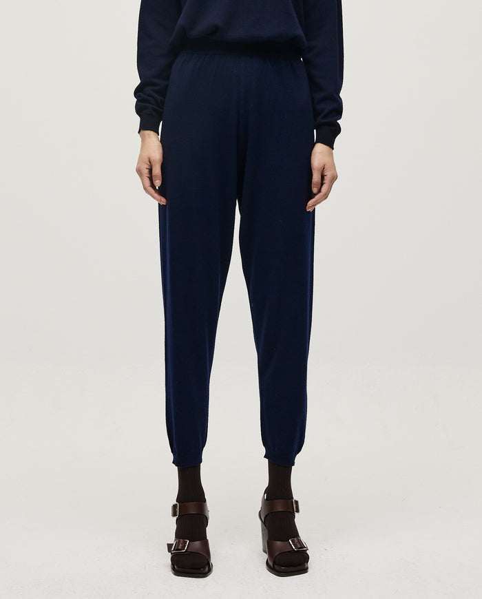 Navy Babaà No25 women's trousers laid flat, showing the tailored fit and clean design on a white background.