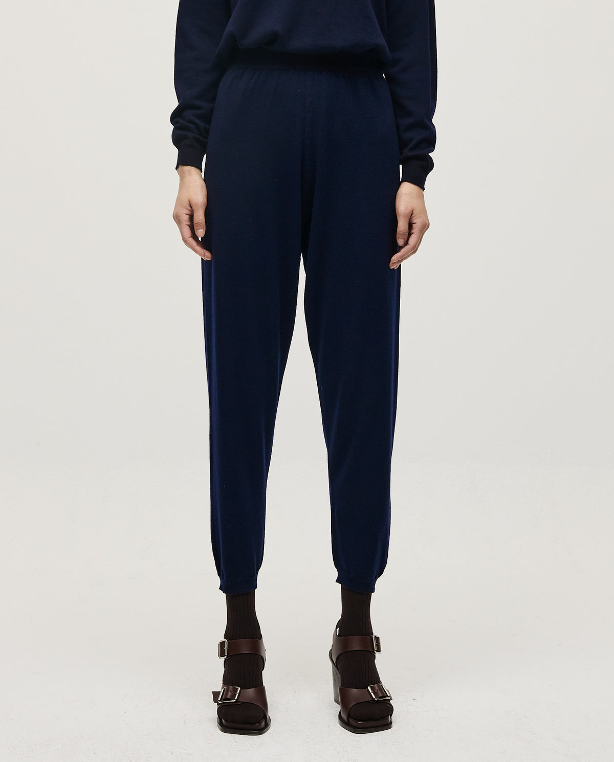 Navy Babaà No25 women's trousers laid flat, showing the tailored fit and clean design on a white background.