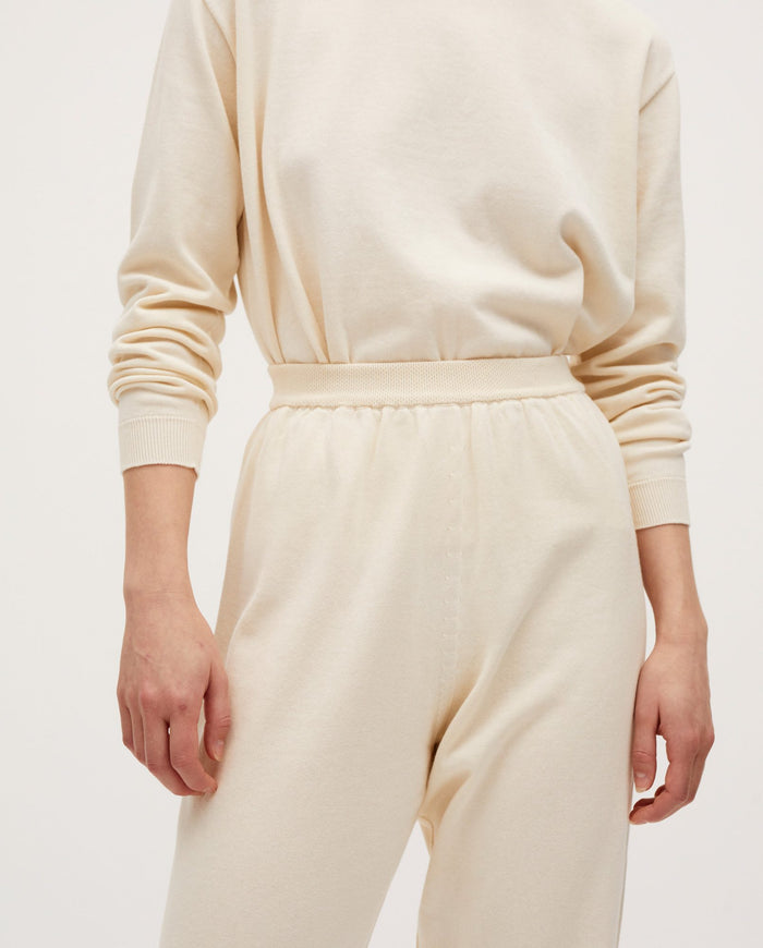 Women's Babaà No37 Natural trousers, showcasing a relaxed fit in soft, natural fabric with a waistband and side pockets.