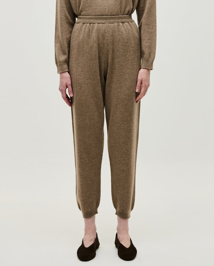 Women’s Babaà No41 Limestone trousers showing a relaxed fit with a tapered design and soft fabric in a neutral limestone color.