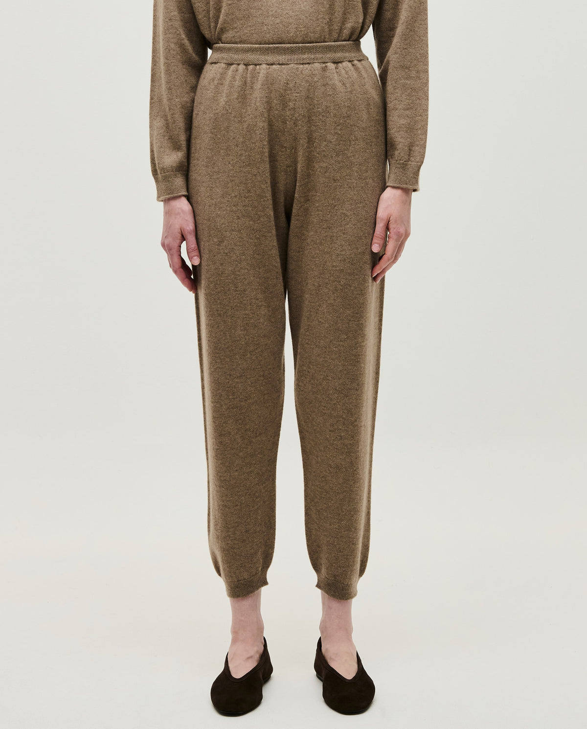 Women’s Babaà No41 Limestone trousers showing a relaxed fit with a tapered design and soft fabric in a neutral limestone color.