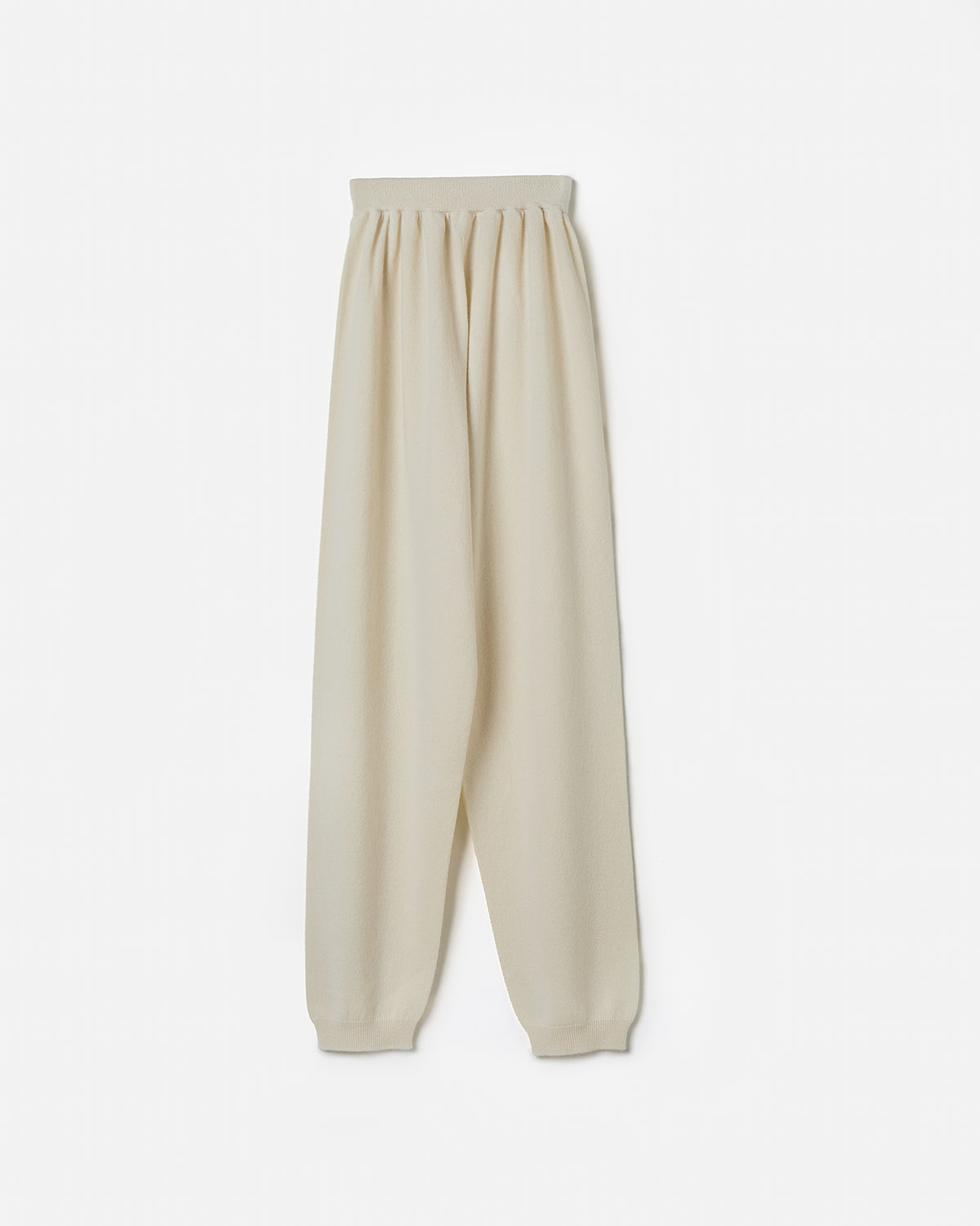 Babaà women's No41 natural trousers with relaxed fit and soft fabric, shown on a model in a casual outdoor setting.