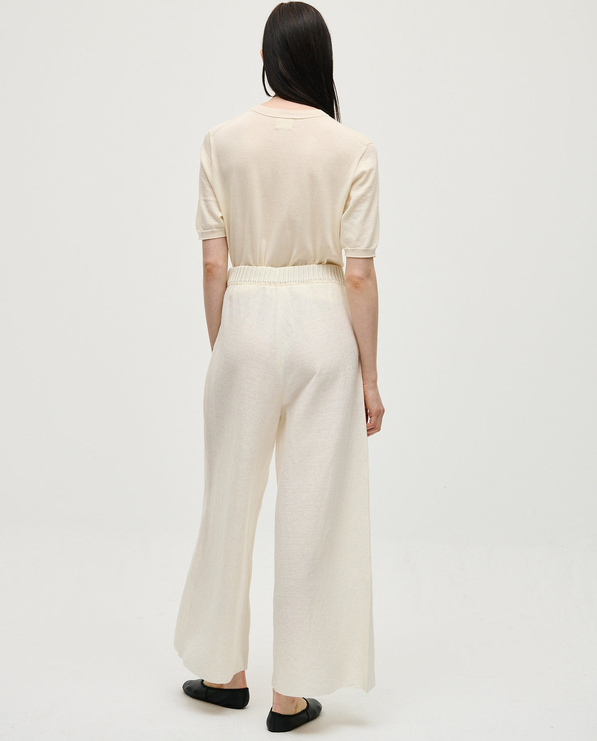 White Babaà No60 women's trousers laid flat, showcasing slim fit and soft fabric, perfect for casual or smart wear.