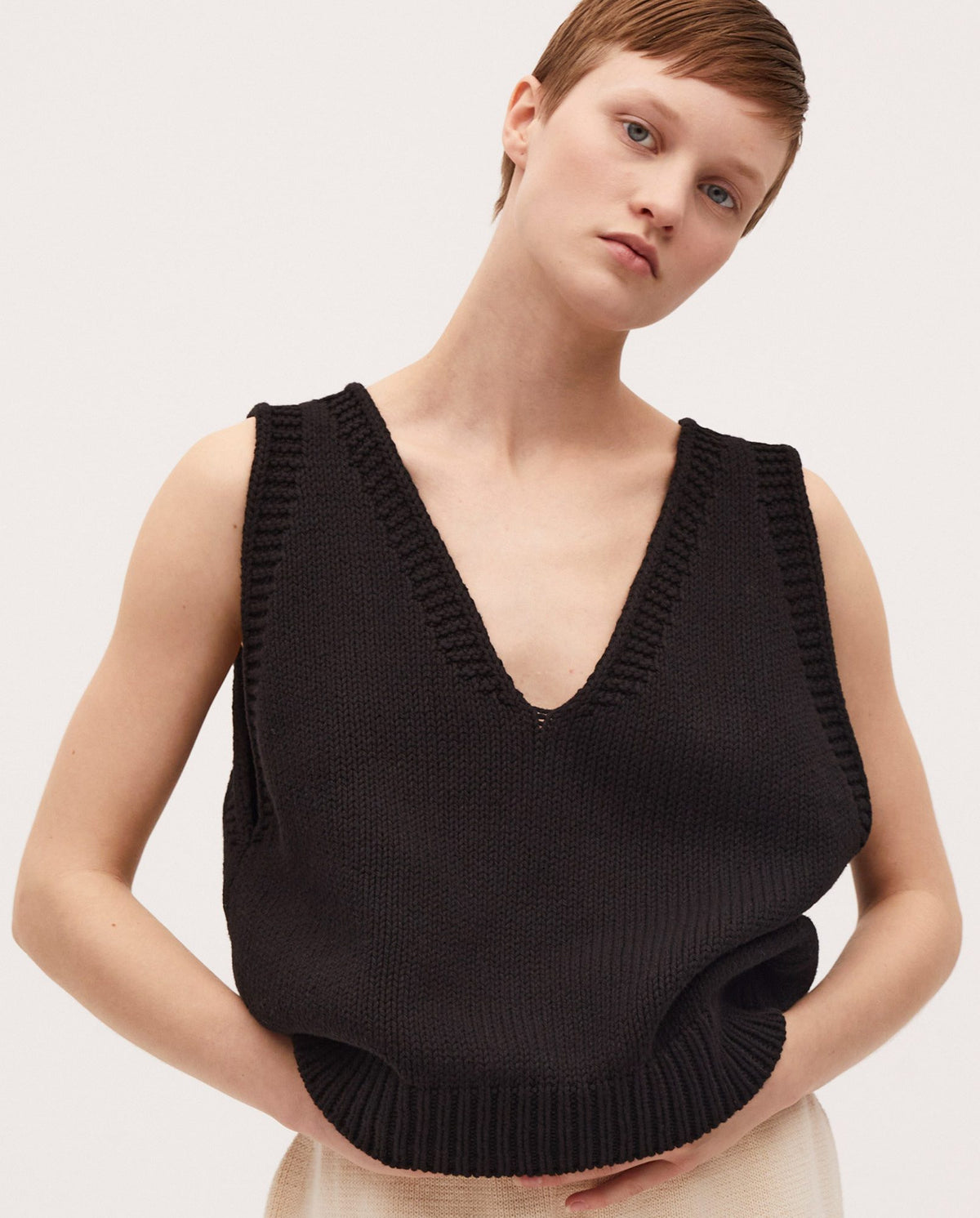 Black Babaà no24 vest showing its sleek design and fabric texture for a stylish layered look.