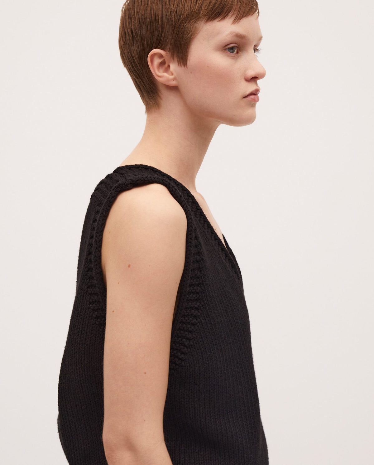 Black Babaà No24 women's vest displayed on a model, showcasing its stylish design and fit.