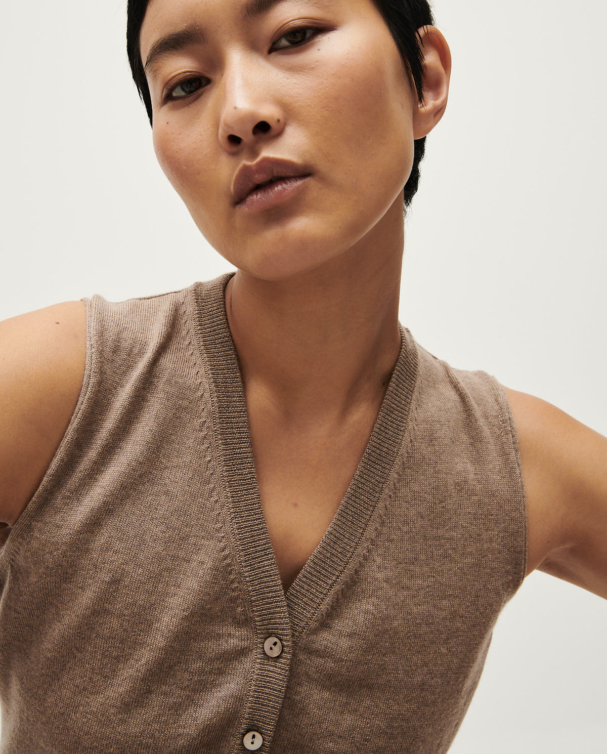 White Babaà No25 vest for women, soft fabric, and stylish design, shown on a model.