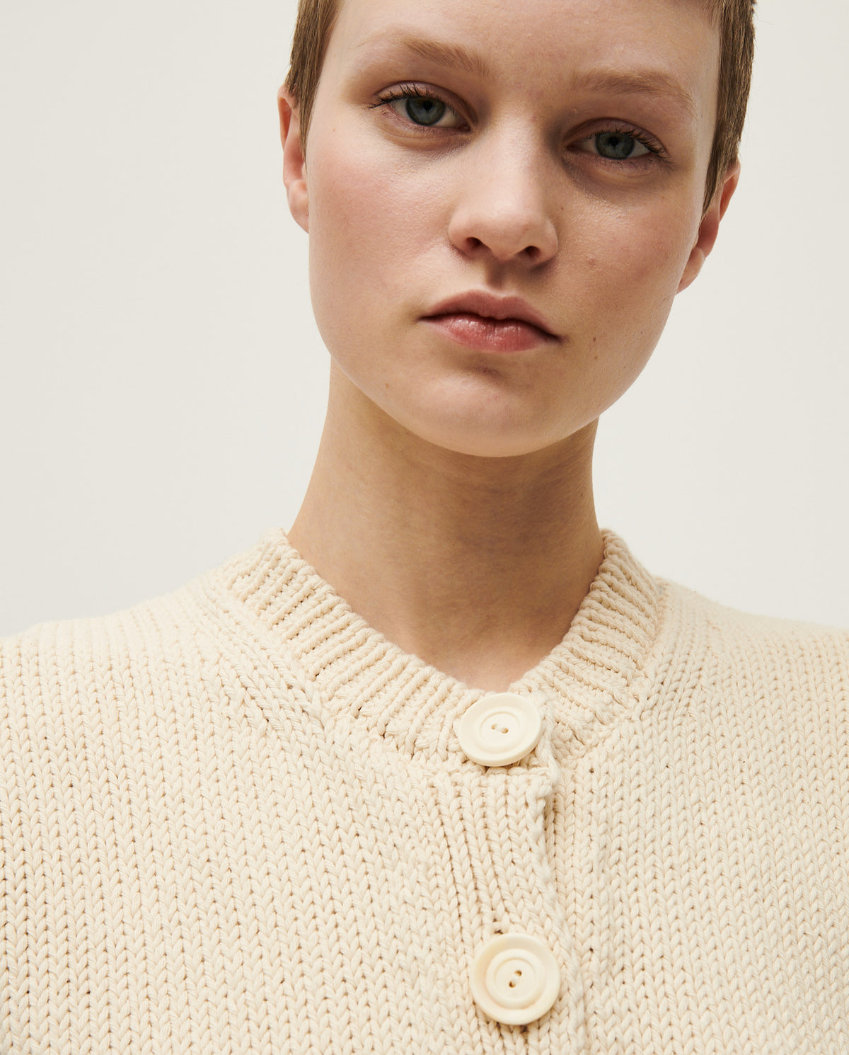 Woman wearing Babaà No26 Natural vest made of soft, lightweight fabric, styled casually for a comfortable look.