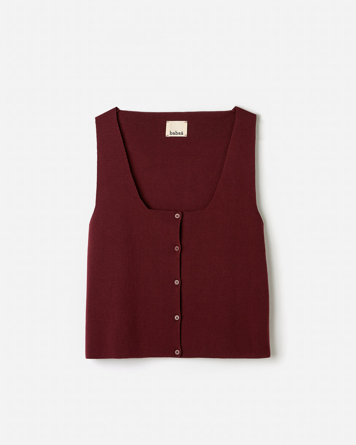 Woman wearing Babaà No39 Cherry vest, showcasing its slim fit and vibrant cherry red color against a neutral background.