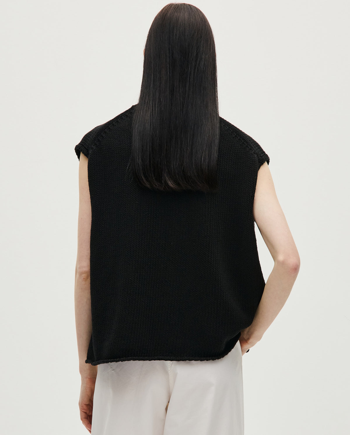 Black Babaà No44 women's vest displayed on a mannequin, featuring a sleek, fitted design with a high neckline and minimalist style.