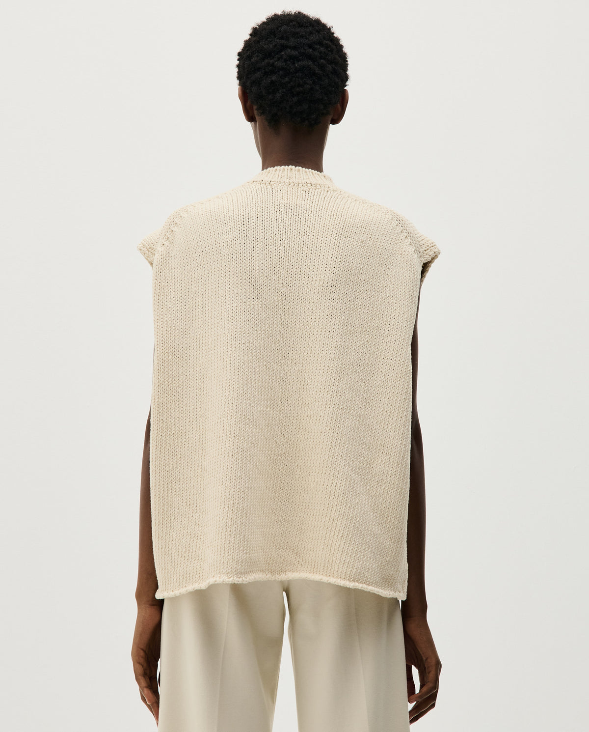 Babaà No44 natural women's vest shown in beige fabric, sleeveless design, with front buttons and a relaxed fit.