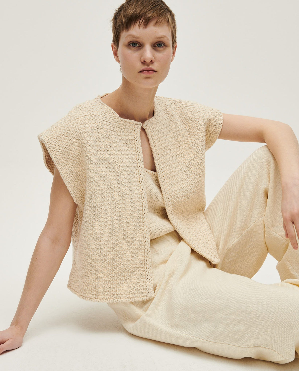 Woman wearing Babaà No8 Natural vest, soft and lightweight sleeveless top with a relaxed fit and natural fabric texture.
