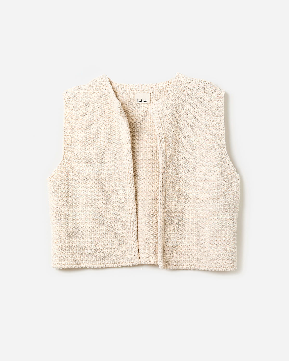 Woman wearing Babaà No8 Natural vest, featuring a relaxed fit and soft fabric, shown in a front silhouette view.
